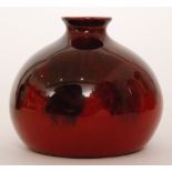 An early 20th Century Bernard Moore vase of compressed ovoid form decorated in a flambe glaze with