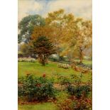 BEATRICE PARSONS (1870-1955) - A view of a garden with roses in bloom, watercolour, signed, framed,