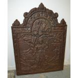 A cast iron fire back of arch shaped form with the date facsimile date of 1679 depicting a figure
