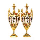 A pair of large Royal Crown Derby twin handled pedestal vases decorated in the Imari 1128 pattern,