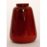An early 20th Century Bernard Moore vase of tapering barrel form decorated in a flambe red with