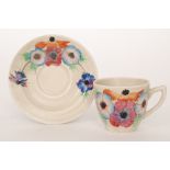 A Clarice Cliff Anemone pattern Lynton shape coffee cup and saucer circa 1936,