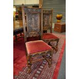Six late Victorian oak dining chairs with floral top rails above foliate carved back panels,