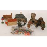 A mid 20th Century children's wooden farm with various buildings, fences and trees,