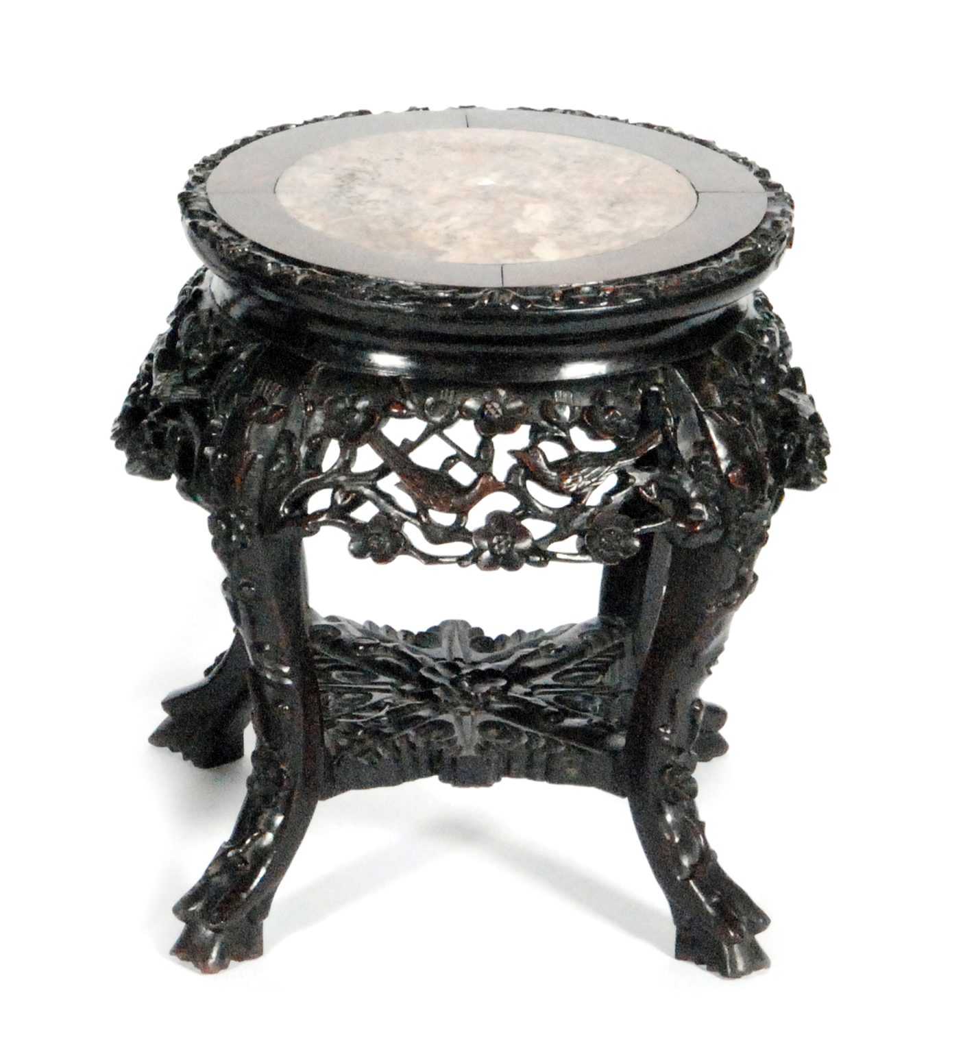 An Oriental export hardwood jardiniere stand with rouge marble inset top above the apron carved