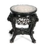An Oriental export hardwood jardiniere stand with rouge marble inset top above the apron carved