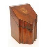A George III mahogany serpentine knife box with oval shell patera, lacking interior,