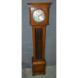 A 1920s oak cased Grandmother clock with eight day striking movement and circular silvered Arabic