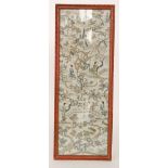 An early 19th Century Chinese embroidered panel depicting figures in garden scenes amidst fauna and