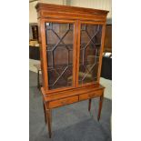 A reproduction mahogany side cabinet in the Sheraton style,