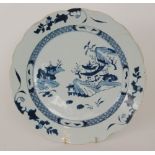 A large Chinese blue and white Nanking Cargo charger decorated with a Chinoiserie landscape within