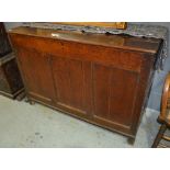 An early oak blanket chest the hinged top over a triple panelled front on stiles,