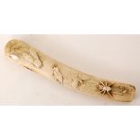 A Meiji period Japanese carved bone kiseruzutsu or pipe case carved in high relief with insects to