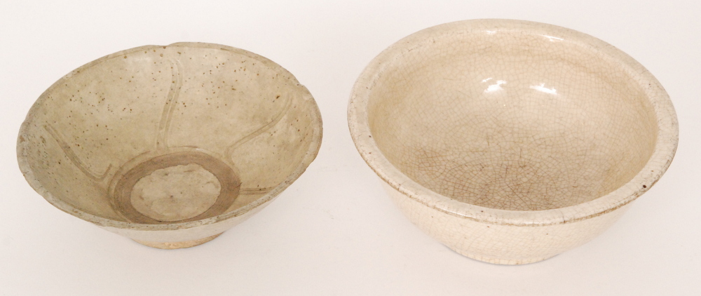 A Chinese Song/Yuan Dynasty Ding type bowl of footed circular form decorated with incised wave