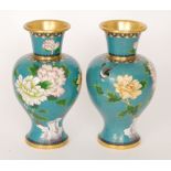 A pair of 20th Century Chinese cloisonne enamelled vases decorated with birds in flight and flowers