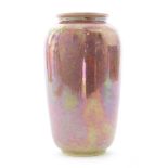 An early 20th Century Ruskin Pottery pink lustre vase decorated to the shoulder with a hand painted