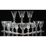 A group of twelve 18th Century and later glasses comprising plain, knopped,