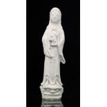 A Ching Dynasty 19th Century Chinese blanc de chine figure modelled as a tall Guanyin or Holy