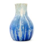 A 1930s Ruskin Pottery crystalline glaze vase decorated in a tonal blue over a cream ground,