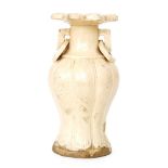 A Chinese Ming Dynasty or later vase of fluted baluster form with collar neck and petal edged rim,