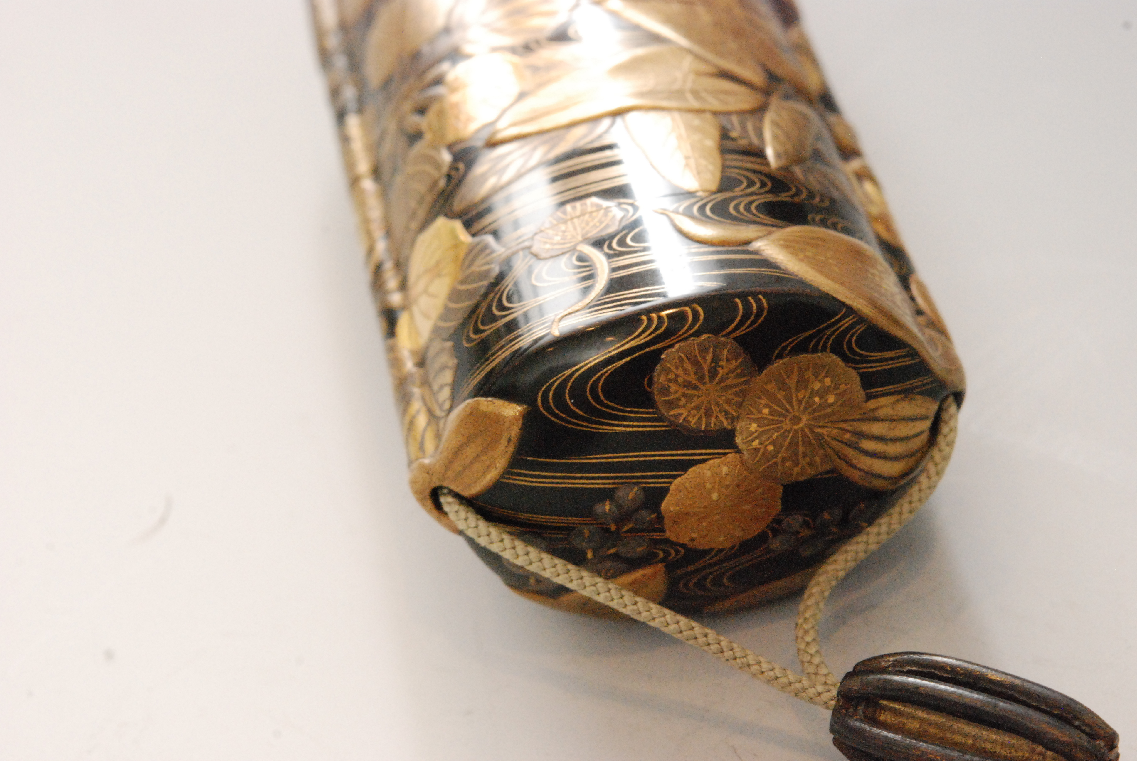 An early 19th Century five case inro finely decorated with water plants in a rippling stream in - Image 6 of 9