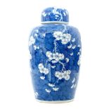 A large prunus blossom vase and cover,