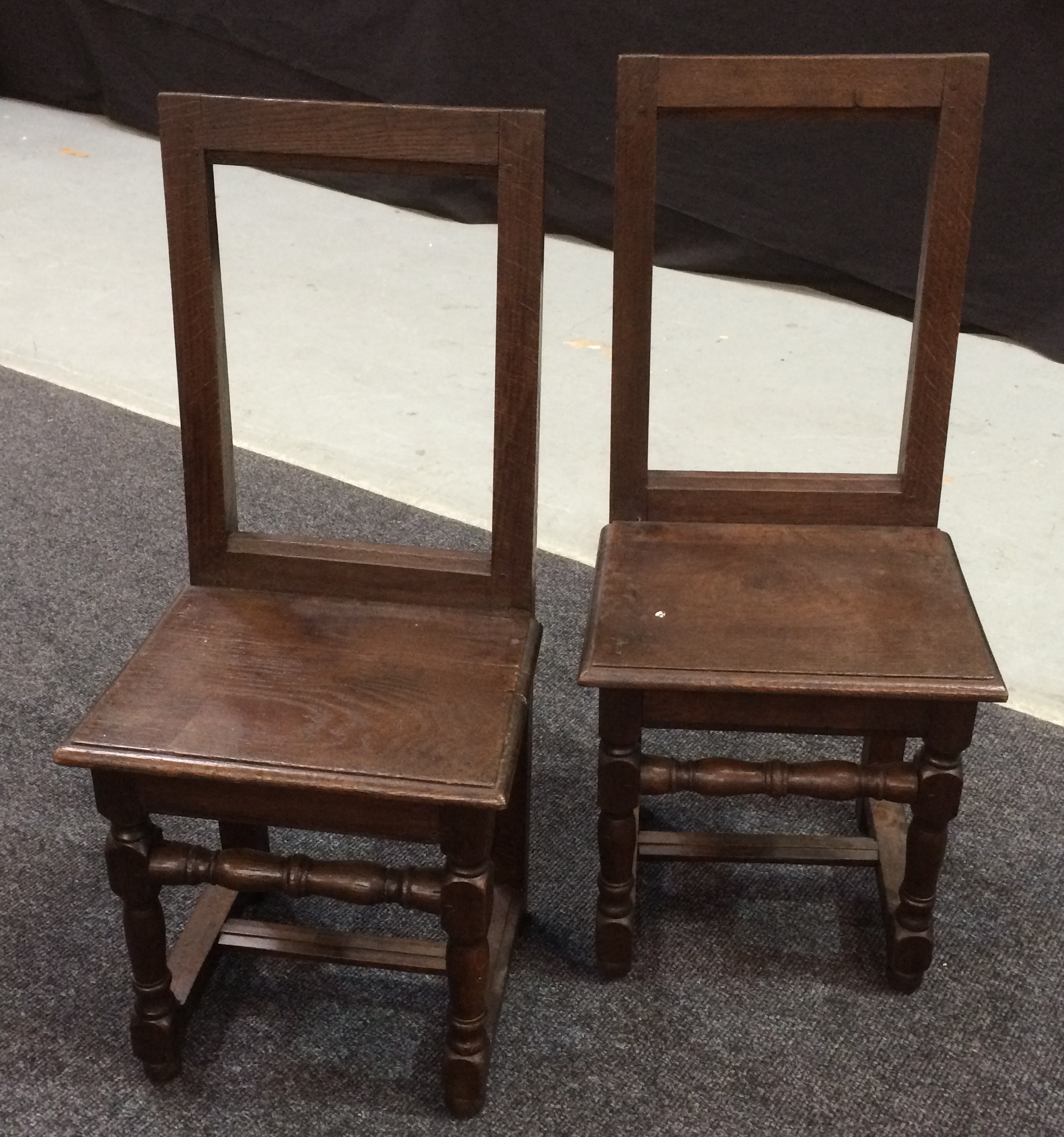 A pair of late 18th to early 19th Century oak backstools,