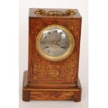 A late 19th Century marquetry inlaid rosewood mantle clock with circular silvered dial and eight
