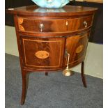 A 19th Century marquetry inlaid bow front corner washstand with single frieze drawer over a double