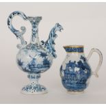 A late 19th to early 20th Century Delft pedestal ewer decorated to one side with a lady walking