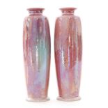 A pair of early 20th Century Ruskin Pottery rolling pin vases each decorated in a pink Strawberry