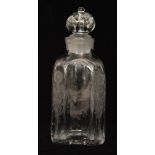 An 18th Century glass spirit flask of pillared sleeve form engraved with flowers below a repeat