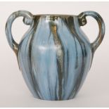 A 1930s Candy Ware twin handled amphora vase glazed in a streaked tonal blue glaze with ochre