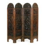 A 20th Century Oriental export four panel hardwood folding screen,