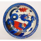 An early 20th Century Wardle Pottery bowl decorated with a blue and red dragon amidst flaming