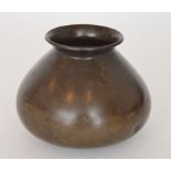 A Chinese possibly Ming Dynasty bronze bowl or censer, of plain squat tapering form to rounded base,