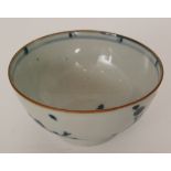 A Chinese blue and white Nanking Cargo footed bowl decorated with blossom and a panel of fence,