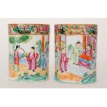 A pair of Chinese Qing Dynasty early 19th Century famille rose brush pots both hand painted with