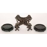 A Chinese carved soapstone stand of pierced form,