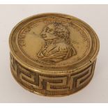 A 19th Century circular brass trinket box commemorating the battles of Admiral Lord Nelson,