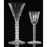 A 19th Century drinking glass in the 18th Century taste, funnel bowl above a multi knopped,