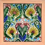 William De Morgan - A framed four tile panel decorated with a repeat pattern of carnations,