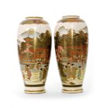 A pair of 19th Century Japanese Meiji period Satsuma vases each decorated with robed figures stood
