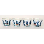 A set of four Chinese octagonal footed tea bowls decorated to each panel with a hand painted figure