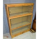 A three-tier Warwick oak veneered bookcase, width 84cm.