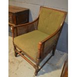 A 1920s cane bergere elbow chair