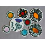 Ann Wynn Reeves and Kenneth Clark - Eight circular tiles or coasters each decorated with copper