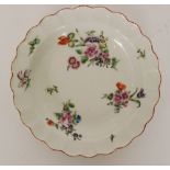 A late 18th Century Worcester shallow dish with wavy edge decorated with sprays of flowers with a