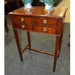 An early 20th Century small mahogany side table fitted with four short drawers,