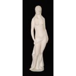A large Lladro figure of a standing nude lady with pale green tinting, marks obscured by felt base,